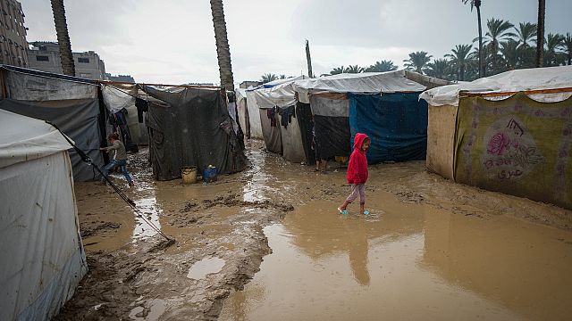 In central Gaza, rain floods the tents of displaced Palestinians